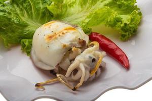 Grilled cuttlefish on the plate photo