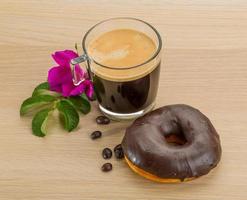 Chocolate donuts on wooden plate photo