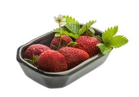 Ripe strawberry in a bowl on white background photo