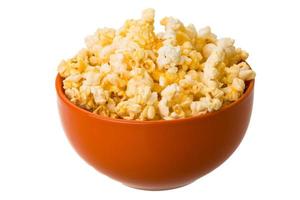 Popcorn in a bowl on white background photo