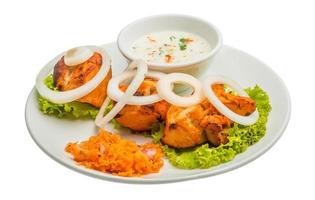 Chicken Tikka on the plate and white background photo