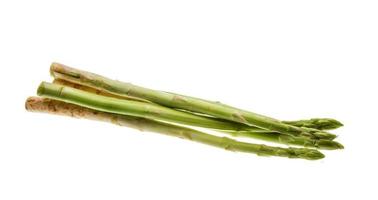 Raw asparagus on white background photo