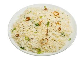 Cumin rice on the plate and white background photo