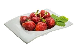 Ripe strawberry in a bowl on white background photo