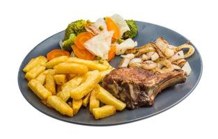 T-bone steak on the plate and white background photo