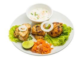 Chicken Tikka on the plate and white background photo