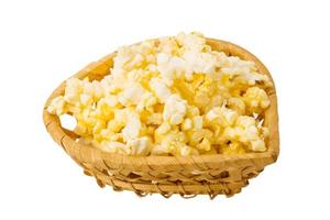 Popcorn in a basket on white background photo