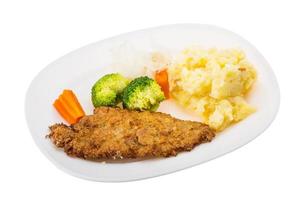 schnitzel on the plate and white background photo