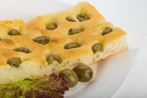 Olive bread on the plate photo