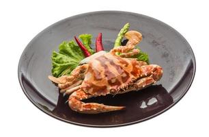 Red crab on the plate and white background photo