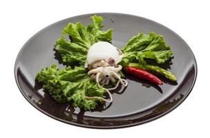 Boiled cuttlefish on the plate and white background photo