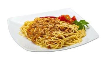 Bolognese spaghetti on the plate and white background photo