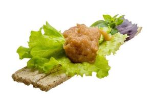 Pollock roe on wooden board and white background photo