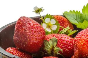 Ripe strawberry in a bowl close up view photo