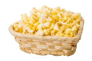 Popcorn in a basket on white background photo