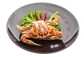 Red crab on the plate and white background photo