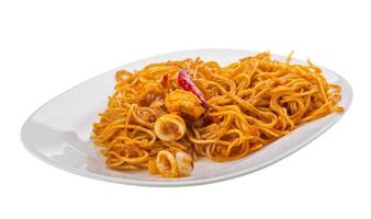 Seafood pasta on the plate and white background photo