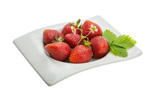 Ripe strawberry in a bowl on white background photo