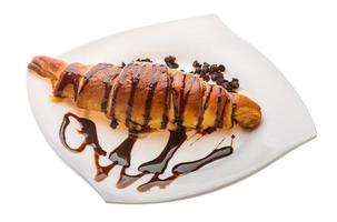 Croissant on the plate and white background photo