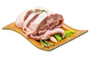 Raw lamb on the plate and white background photo