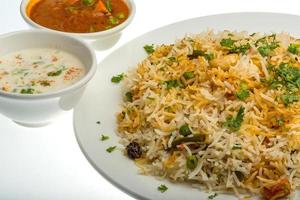 Vigetable Briyani on the plate and white background photo