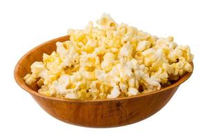 Popcorn in a bowl on white background photo