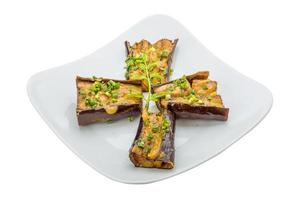 Grilled eggplant on the plate and white background photo