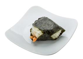 Japan rice ball with salmon on the plate and white background photo