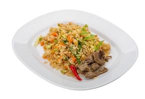 Fried rice with beef on the plate and white background photo