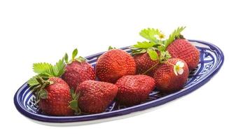Ripe strawberry in a bowl on white background photo