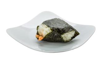 Japan rice ball with salmon on the plate and white background photo