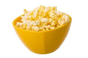 Popcorn in a bowl on white background photo