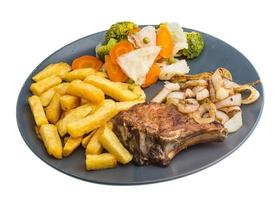 T-bone steak on the plate and white background photo