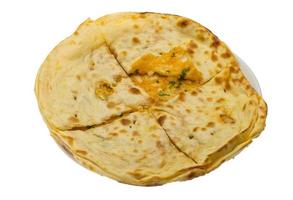 Alu Naan in a basket on white background photo