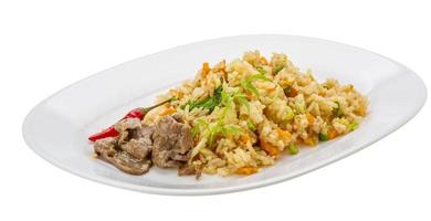 Fried rice with beef on the plate and white background photo