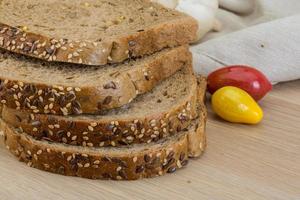 Cereal bread on wooden background photo