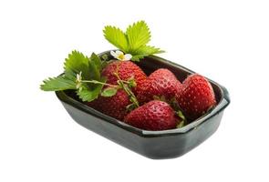 Ripe strawberry in a bowl on white background photo