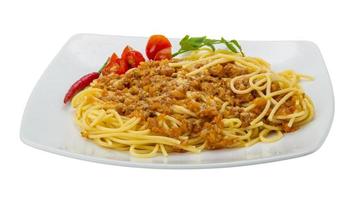 Bolognese spaghetti on the plate and white background photo