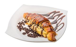 Croissant on the plate and white background photo