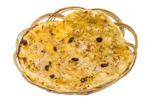 Pishwary naan in a basket on white background photo