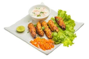 Shish kebab on the plate and white background photo