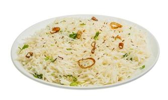 Cumin rice on the plate and white background photo