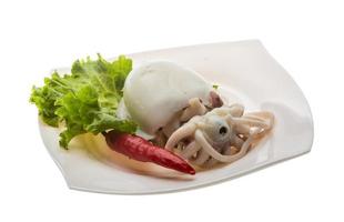 Boiled cuttlefish on the plate and white background photo