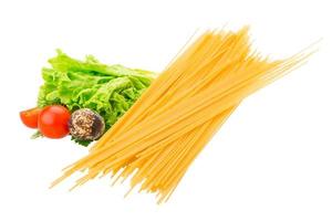 Raw spaghetti on white background photo