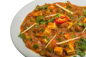 Kadai Paneer on the plate and white background photo