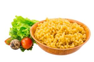 Fusilli pasta in a bowl on white background photo