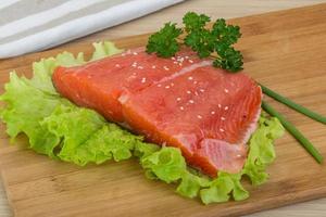 Salmon on wooden board photo