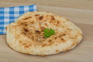 Armenian bread on wooden background photo