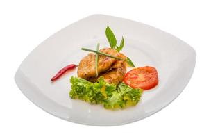 Baracuda steak on the plate and white background photo