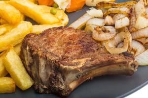 T-bone steak on the plate  close up view photo